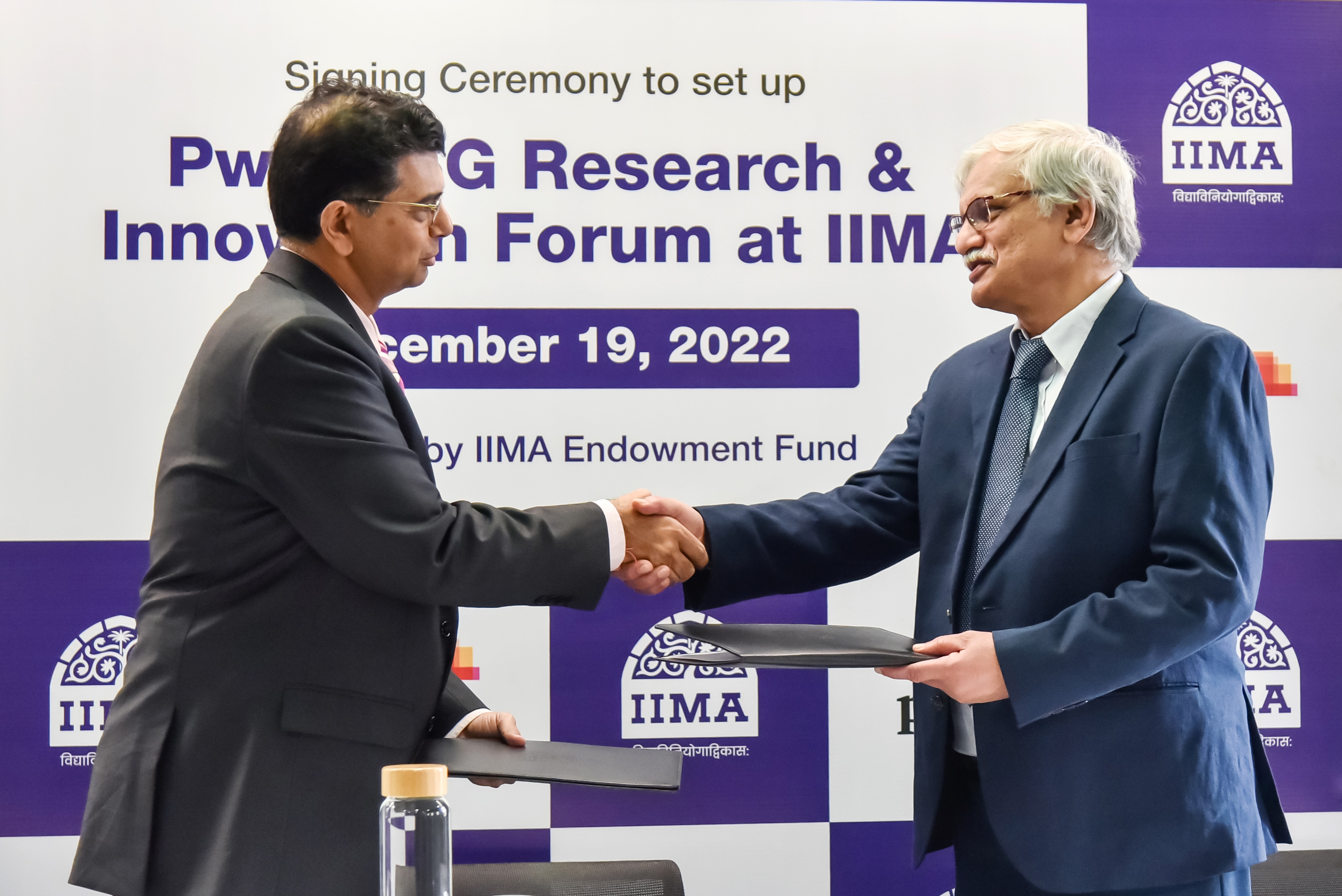 Mr Sanjeev Krishan, Chairperson, PwC in India and Professor Errol D'Souza at the signing ceremony
